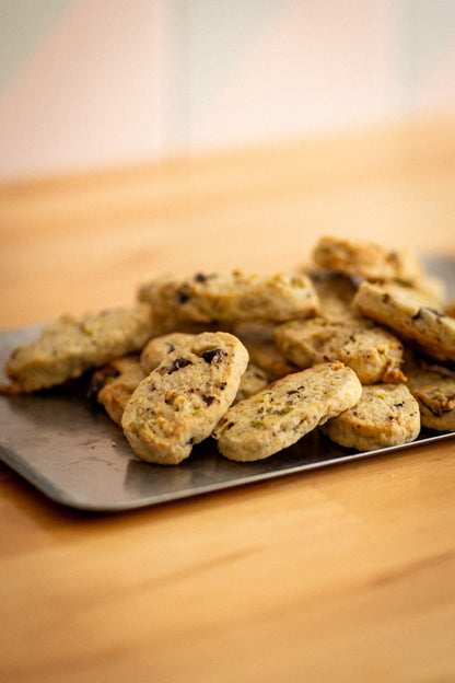 platter of christmas cookies with pistachio and dark chocolate