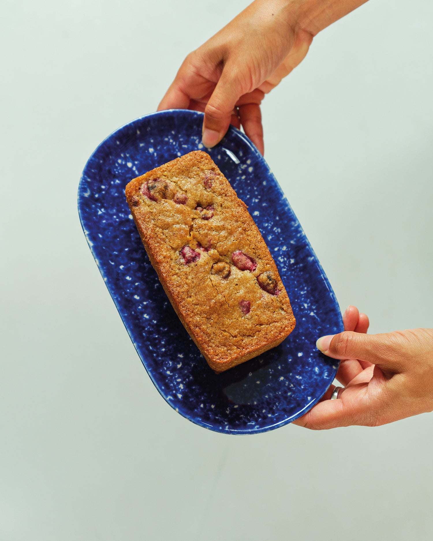 small raspberry loaf being hold